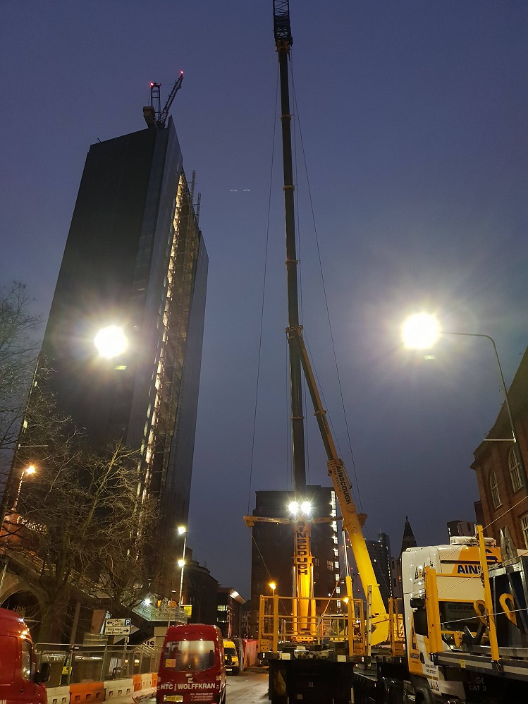 The enormous mobile crane sets up for removal operation