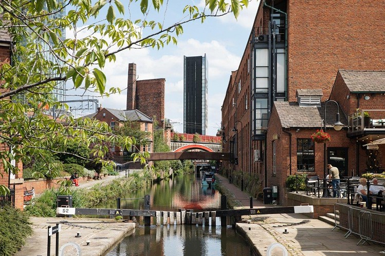 Axis Tower stands on the banks of the Rochdale Canal which runs through Manchester city centre
